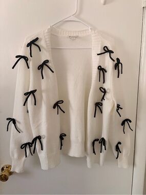 Cato White Open-Front Cardigan with Black Bow Accents